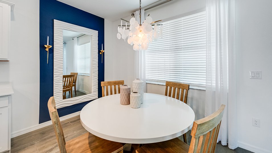 Photograph of the dining area in a completed Lennar Amalfi model home. Photographed in a Lennar model, not at Turnleaf.