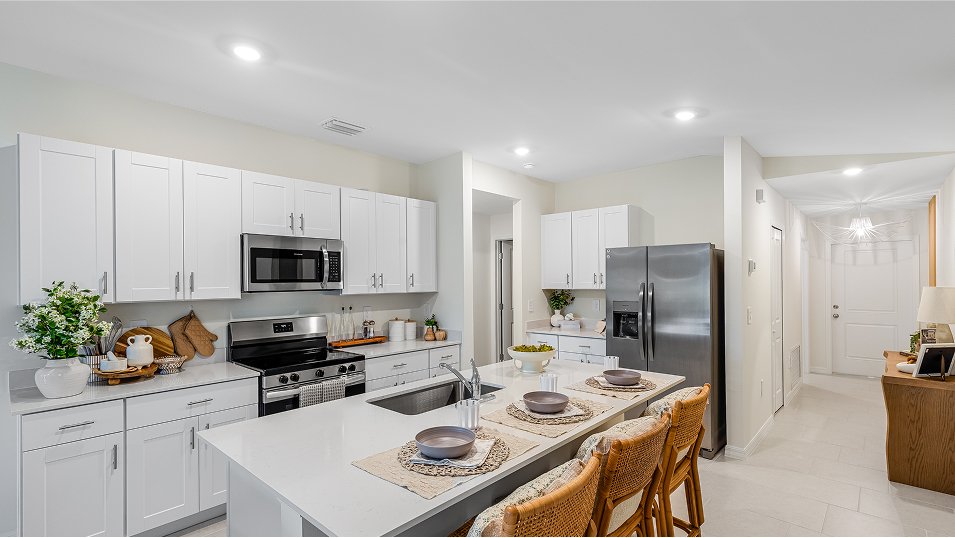 Photograph of the kitchen in a completed Lennar Belmont model home. Photographed in a Lennar model, not at Turnleaf.