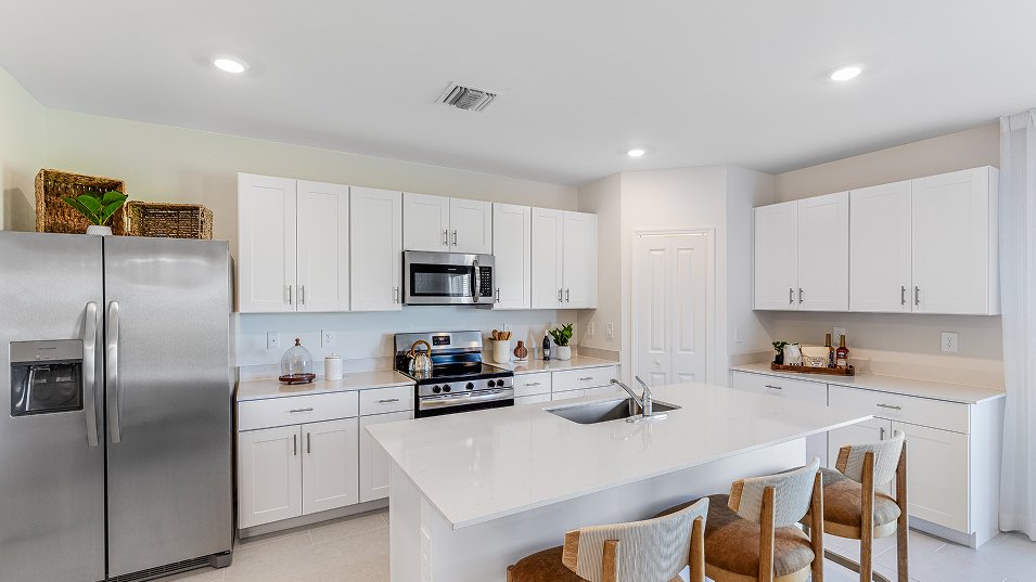 Photograph of the kitchen in a completed Lennar Edison model home. Photographed in a Lennar model, not at Turnleaf.